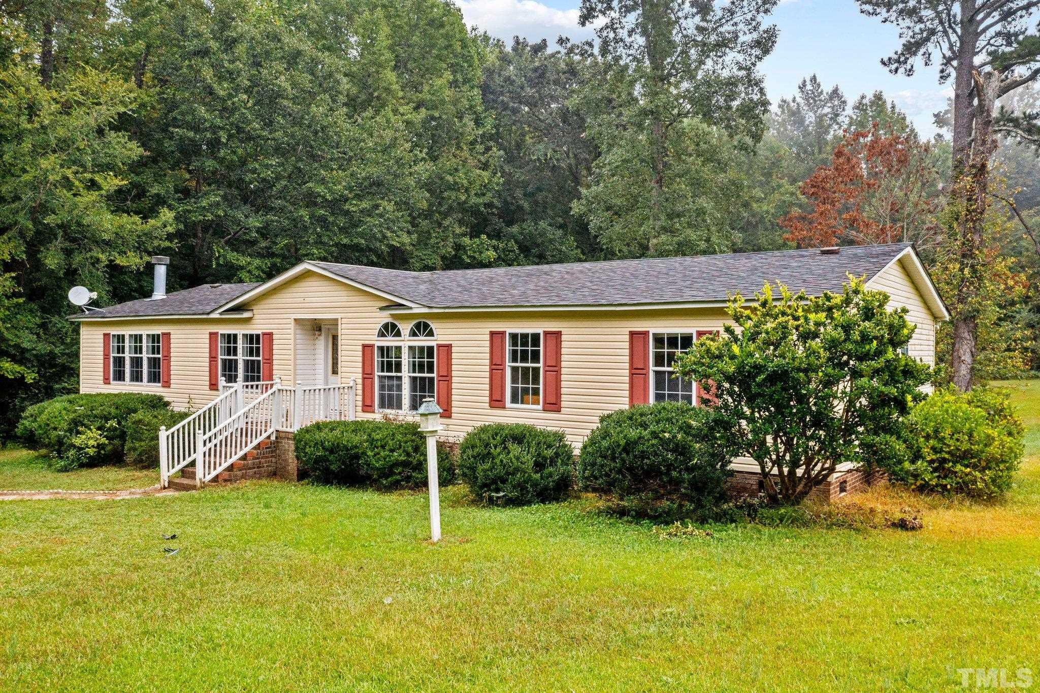 9617 Jernigan Road Spring Hope, NC 27882 - Photo 2 of 41 a view of a house with backyard and garden