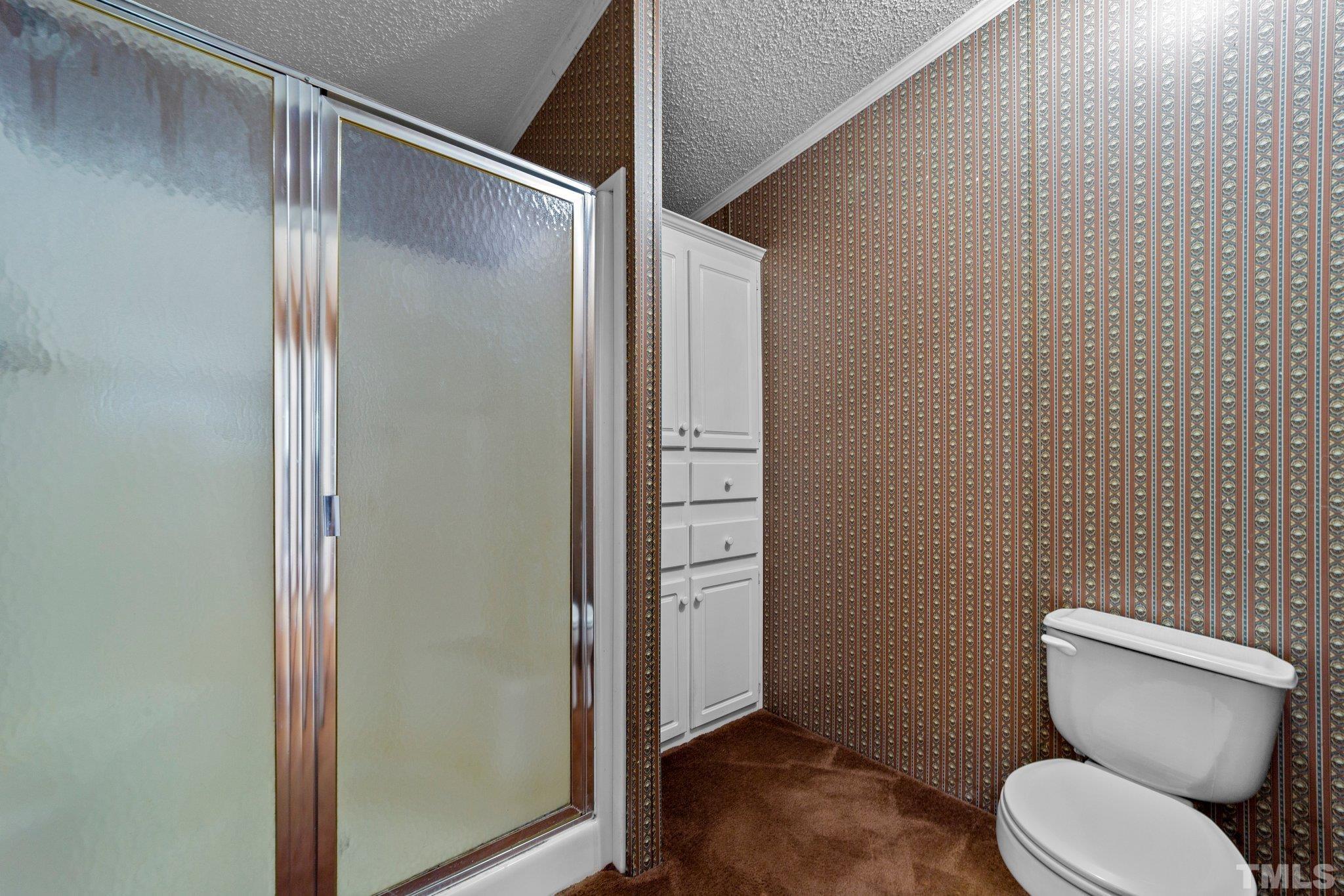 9617 Jernigan Road Spring Hope, NC 27882 - Photo 26 of 41 a bathroom with a toilet and a shower