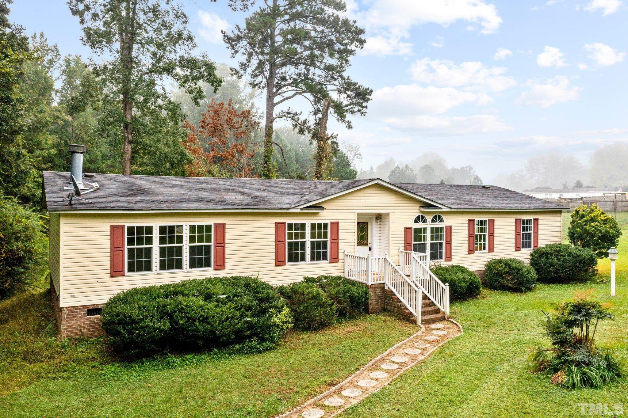 9617 Jernigan Road Spring Hope, NC 27882 - Photo 6 of 41 a front view of a house with a yard