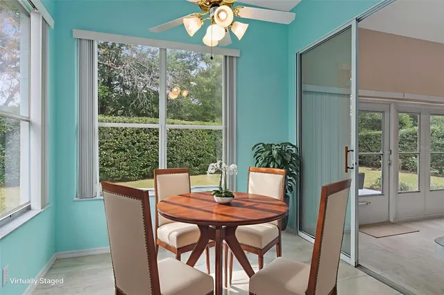 a spacious bedroom with a bed and a chandelier