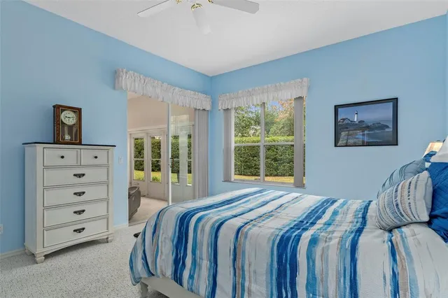 a view of a livingroom with workspace and a couch