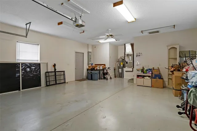 a view of a house with a small yard and plants