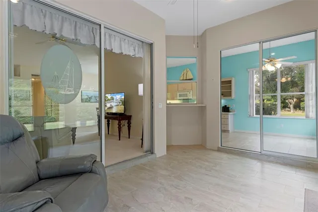 a view of a patio with swimming pool and table