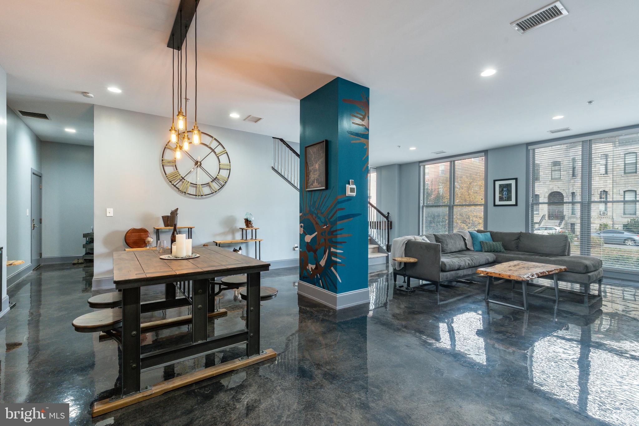 1910 Spring Garden Street, Unit 1 Philadelphia, PA 19130 - Photo 15 of 39 a living room with furniture and a large window