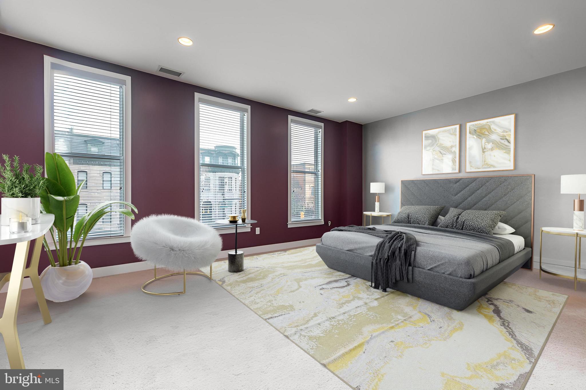 1910 Spring Garden Street, Unit 1 Philadelphia, PA 19130 - Photo 16 of 35 a spacious bedroom with a bed and a large window
