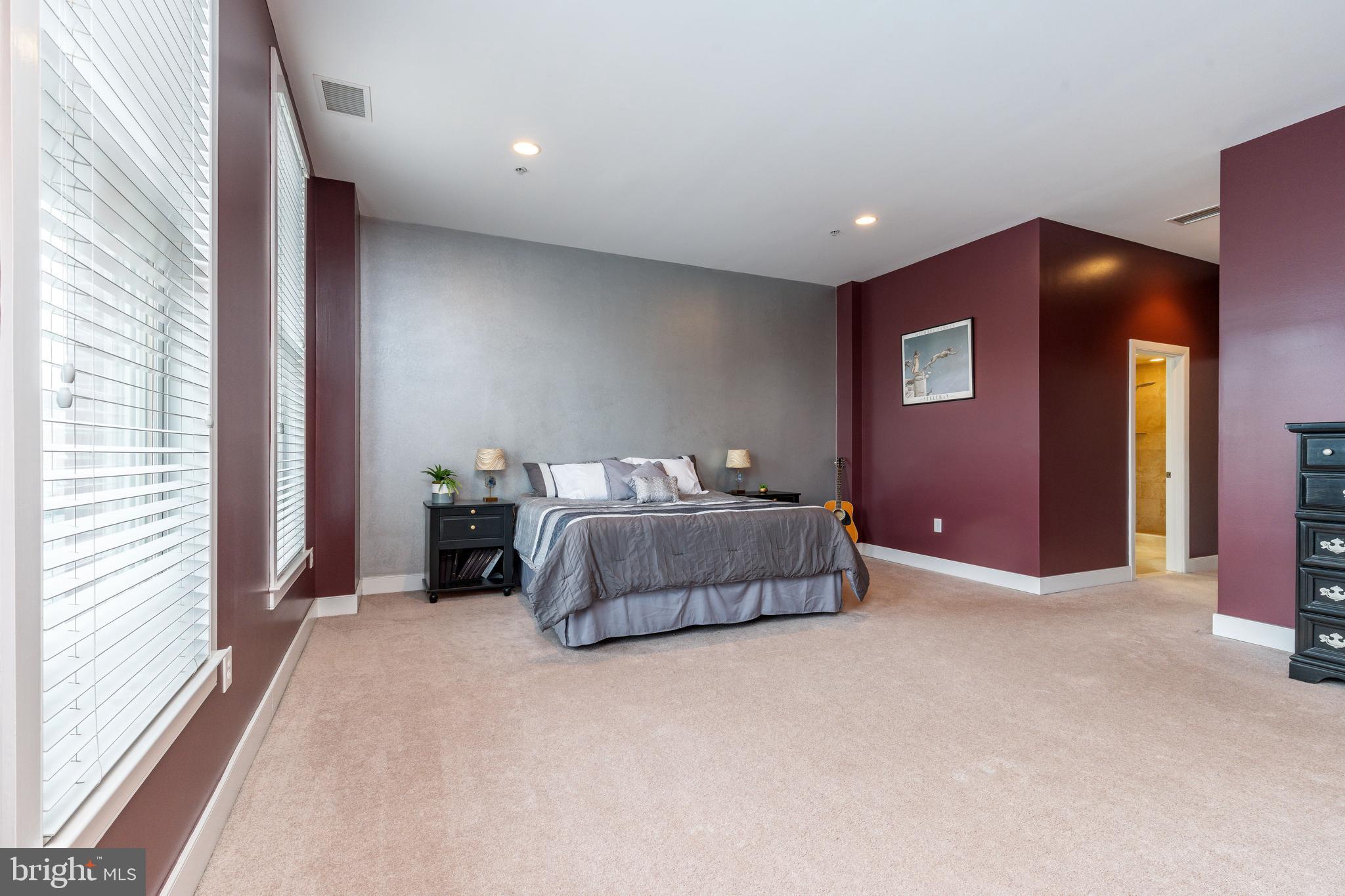 1910 Spring Garden Street, Unit 1 Philadelphia, PA 19130 - Photo 19 of 39 a bedroom with a bed and a window