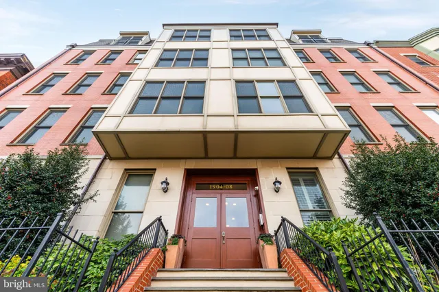 a picture of a building with a clock on the wall