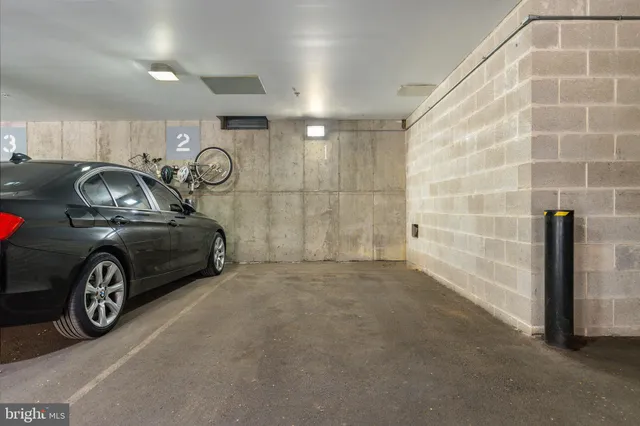 a view of a car garage with a car parked
