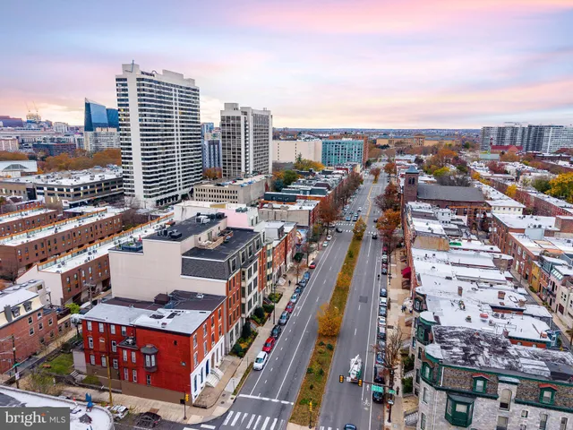 front view of a brick building with many windows