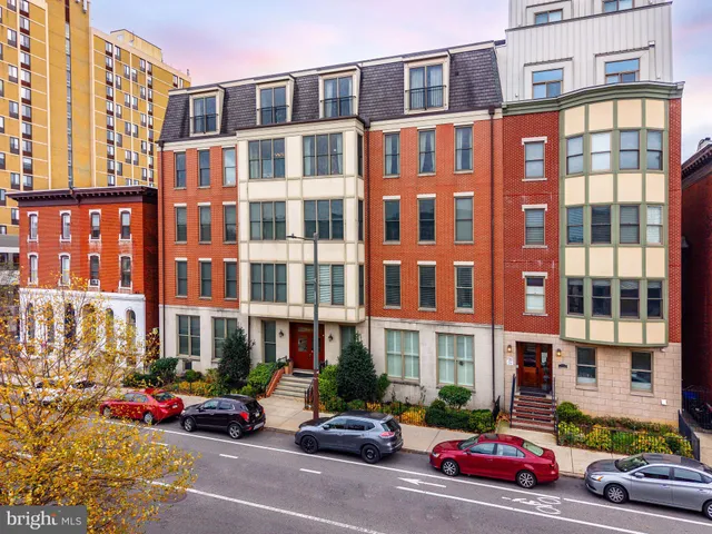 a front view of a building with street view
