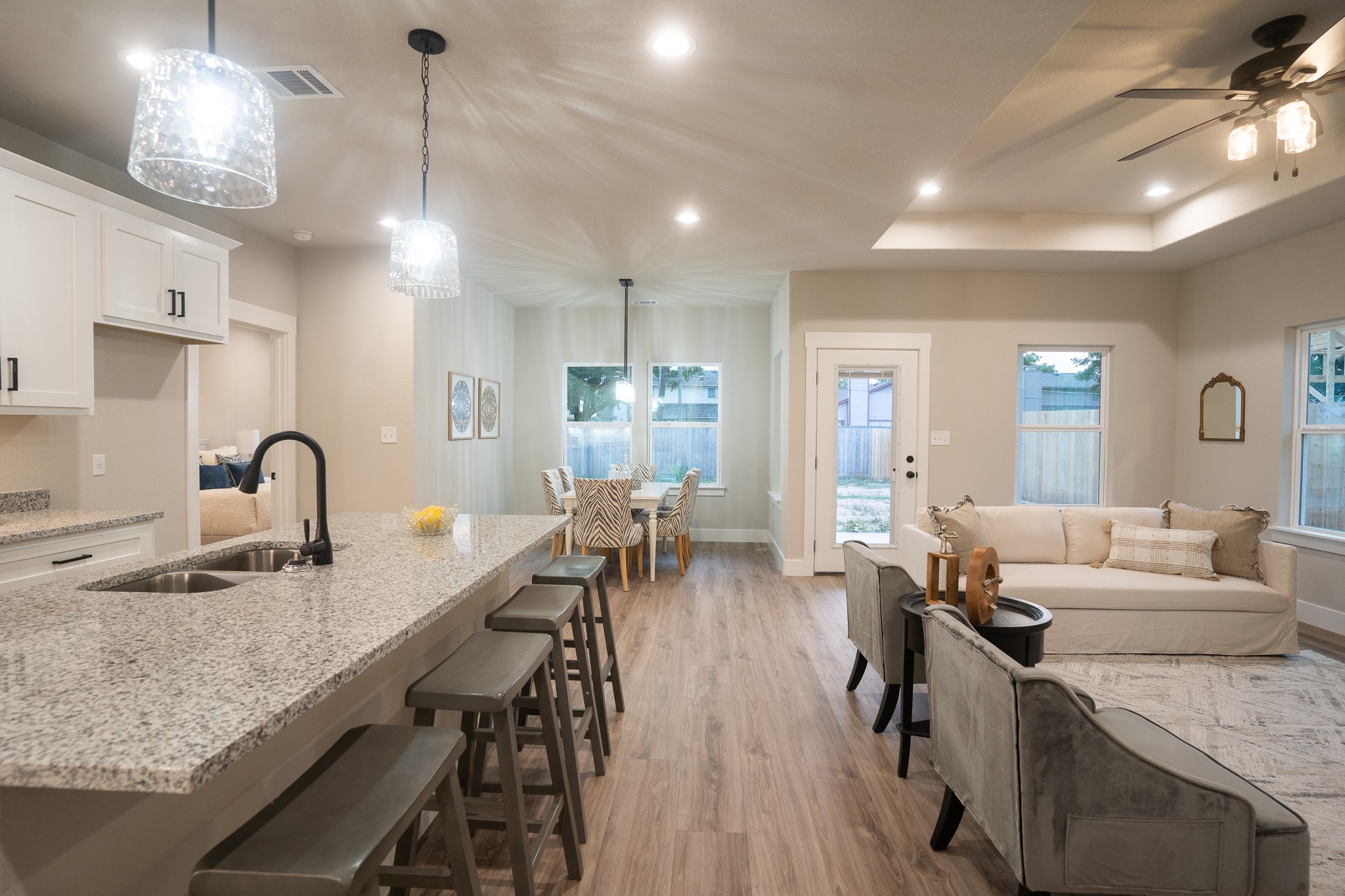 307 String Prairie Way Smithville, TX 78957 - Photo 10 of 34 a very nice looking kitchen with granite countertop lots of counter space a sink dining table and chairs