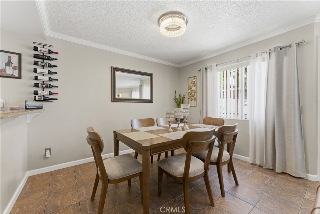 700 West Almond Street Compton, CA 90220 - Photo 13 of 68 a view of a dining room with furniture and chandelier
