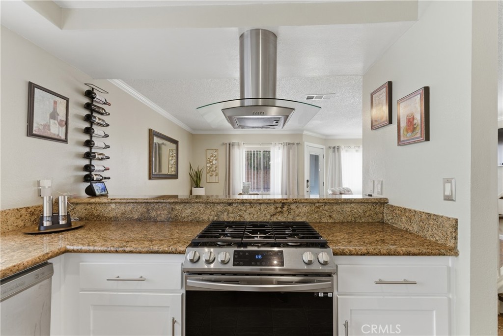 700 West Almond Street Compton, CA 90220 - Photo 18 of 68 a kitchen with stainless steel appliances granite countertop a stove and a sink