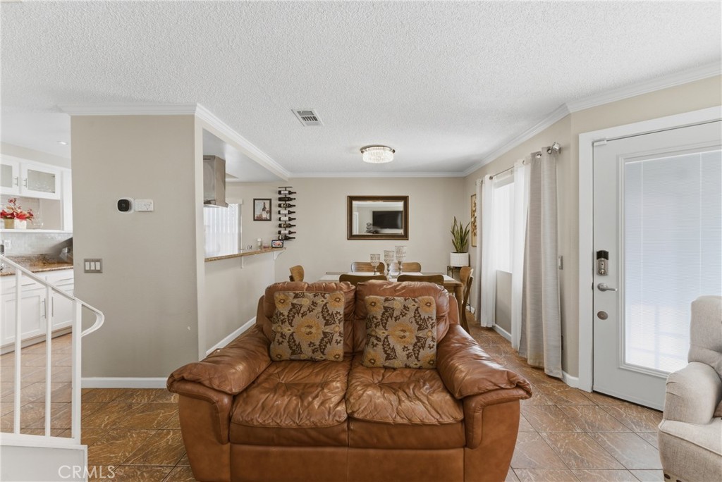 700 West Almond Street Compton, CA 90220 - Photo 22 of 68 a living room with furniture and a window