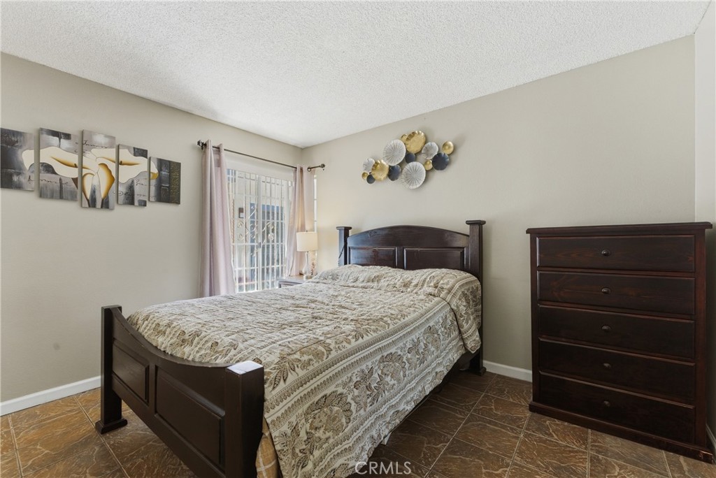 700 West Almond Street Compton, CA 90220 - Photo 26 of 68 a bedroom with a bed and cabinet