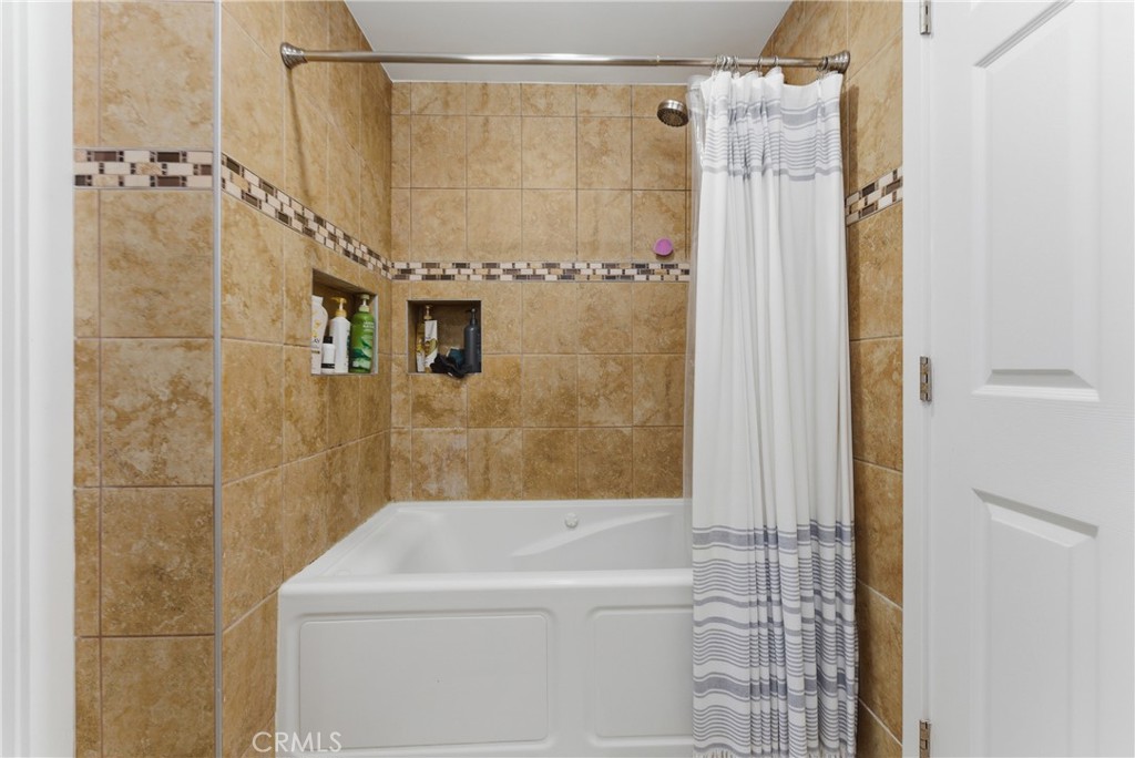 700 West Almond Street Compton, CA 90220 - Photo 38 of 68 a bathroom with a shower and a bathtub