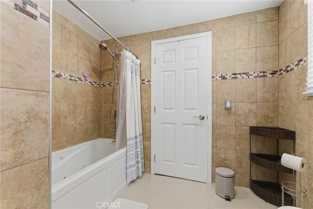 700 West Almond Street Compton, CA 90220 - Photo 40 of 68 a bathroom with a shower and a toilet
