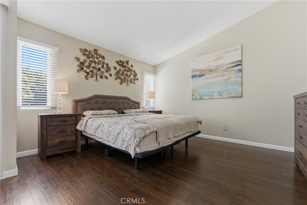 700 West Almond Street Compton, CA 90220 - Photo 45 of 68 a bedroom with a bed and a painting on the wall