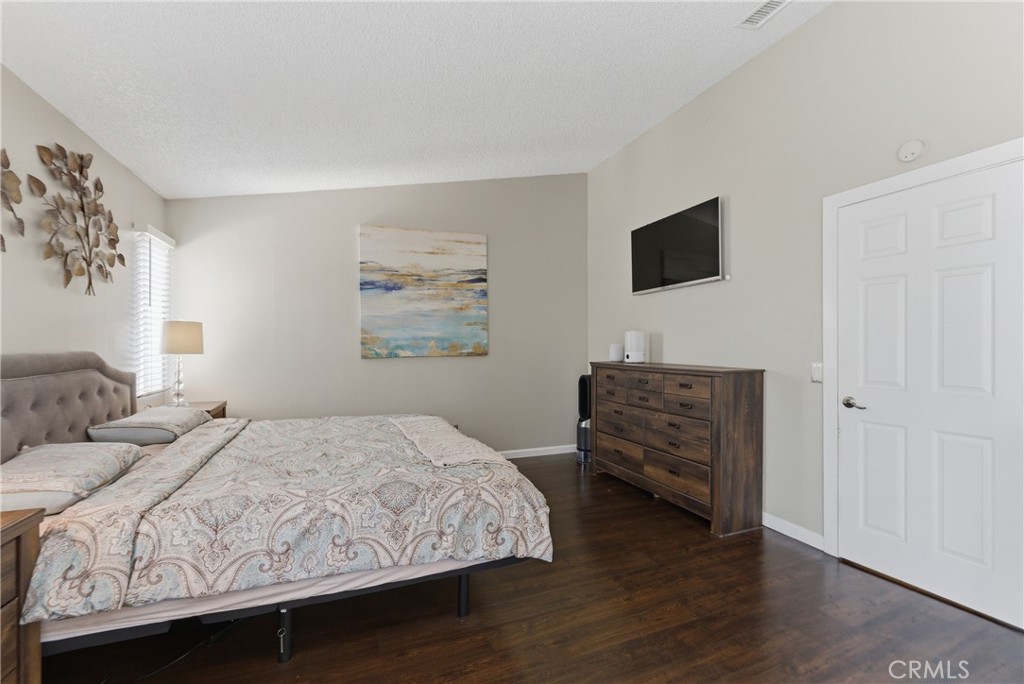 700 West Almond Street Compton, CA 90220 - Photo 47 of 68 a bedroom with a bed and a flat screen tv