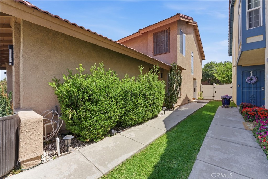 700 West Almond Street Compton, CA 90220 - Photo 7 of 68 a front view of a house with garden