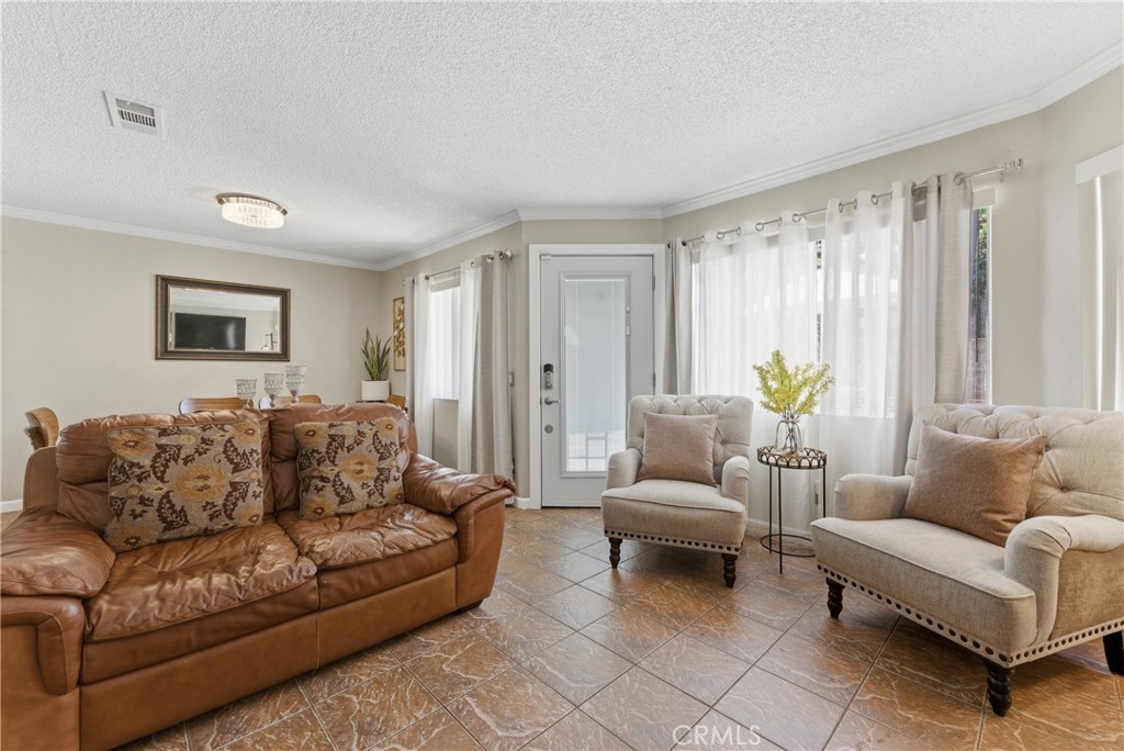 700 West Almond Street Compton, CA 90220 - Photo 9 of 68 a living room with furniture and a couch