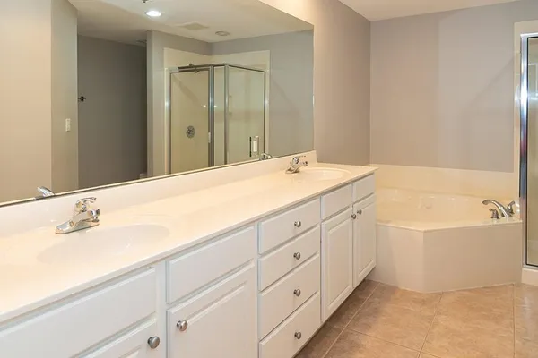 a bathroom with a bathtub and a shower
