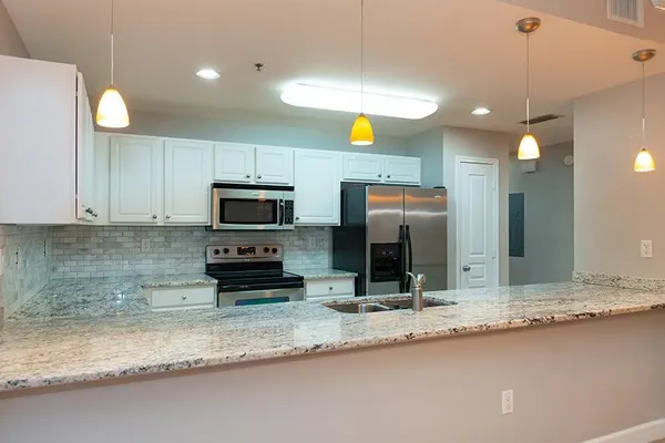 a kitchen with a sink and cabinets