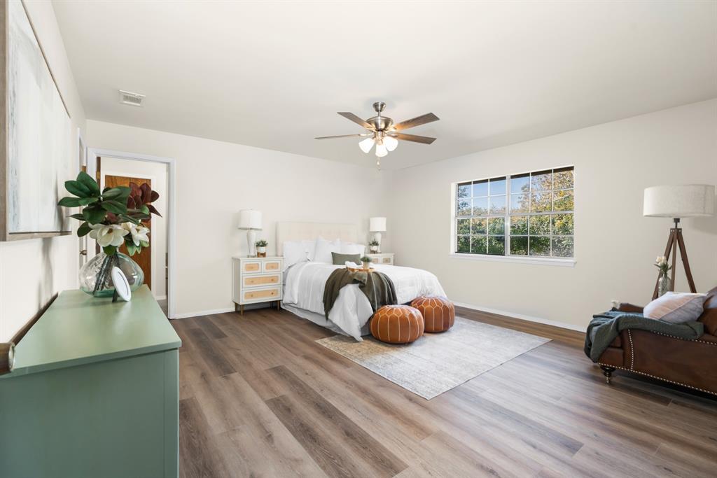 616 South Files Street Itasca, TX 76055 - Photo 15 of 37 a bedroom with furniture and a window