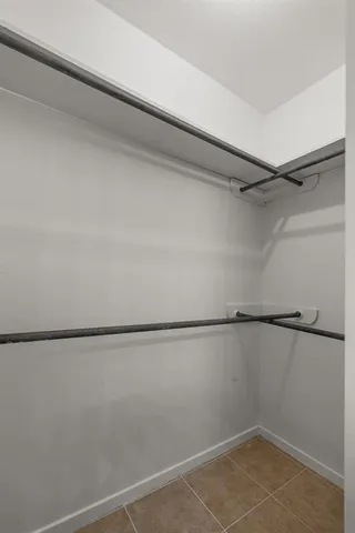 a view of a room with an empty walk in closet