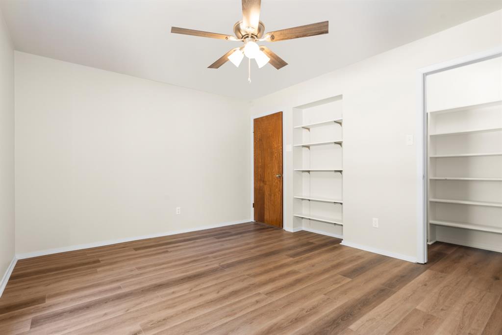616 South Files Street Itasca, TX 76055 - Photo 27 of 37 wooden floor in an empty room