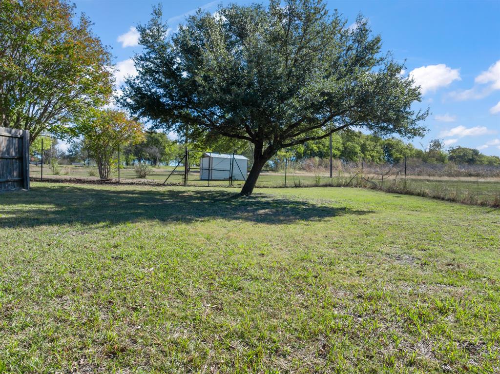 616 South Files Street Itasca, TX 76055 - Photo 29 of 37 a view of pool with green space and trees