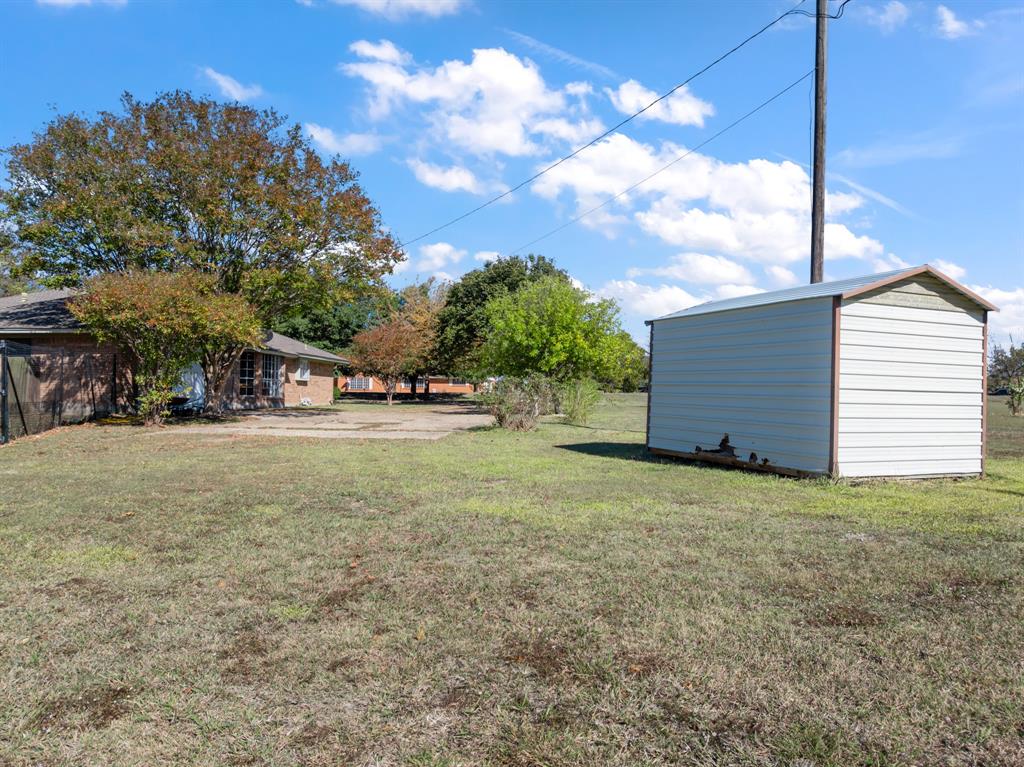 616 South Files Street Itasca, TX 76055 - Photo 30 of 37 a view of street along with trees
