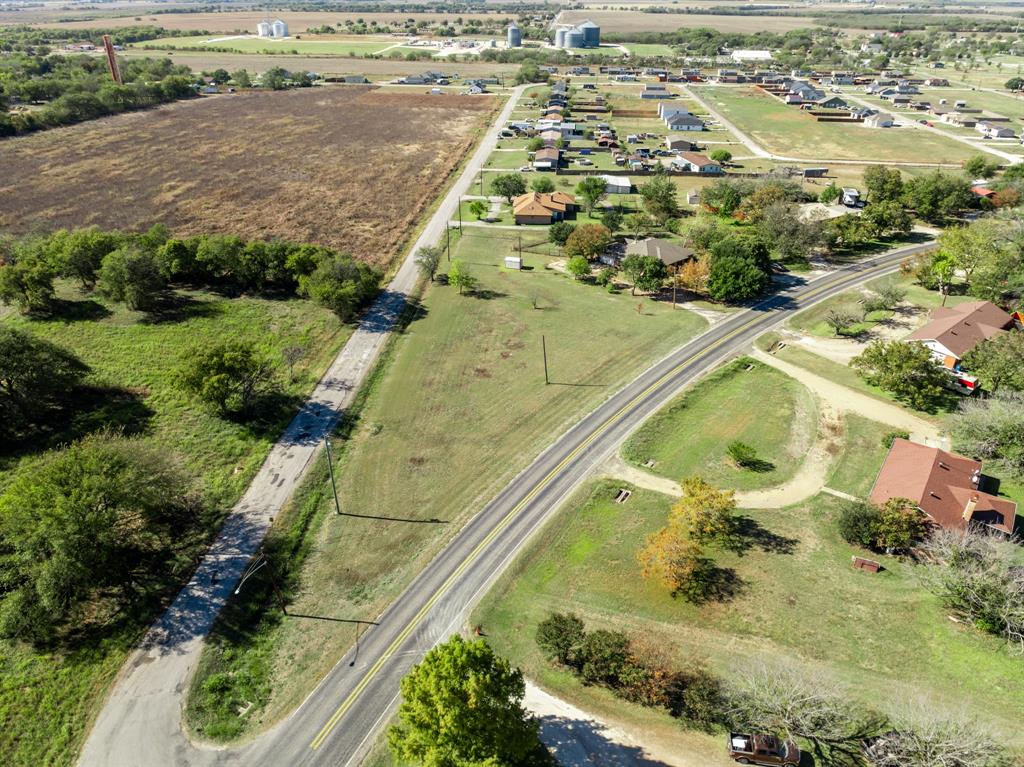 616 South Files Street Itasca, TX 76055 - Photo 3 of 37 an aerial view of residential houses with outdoor space