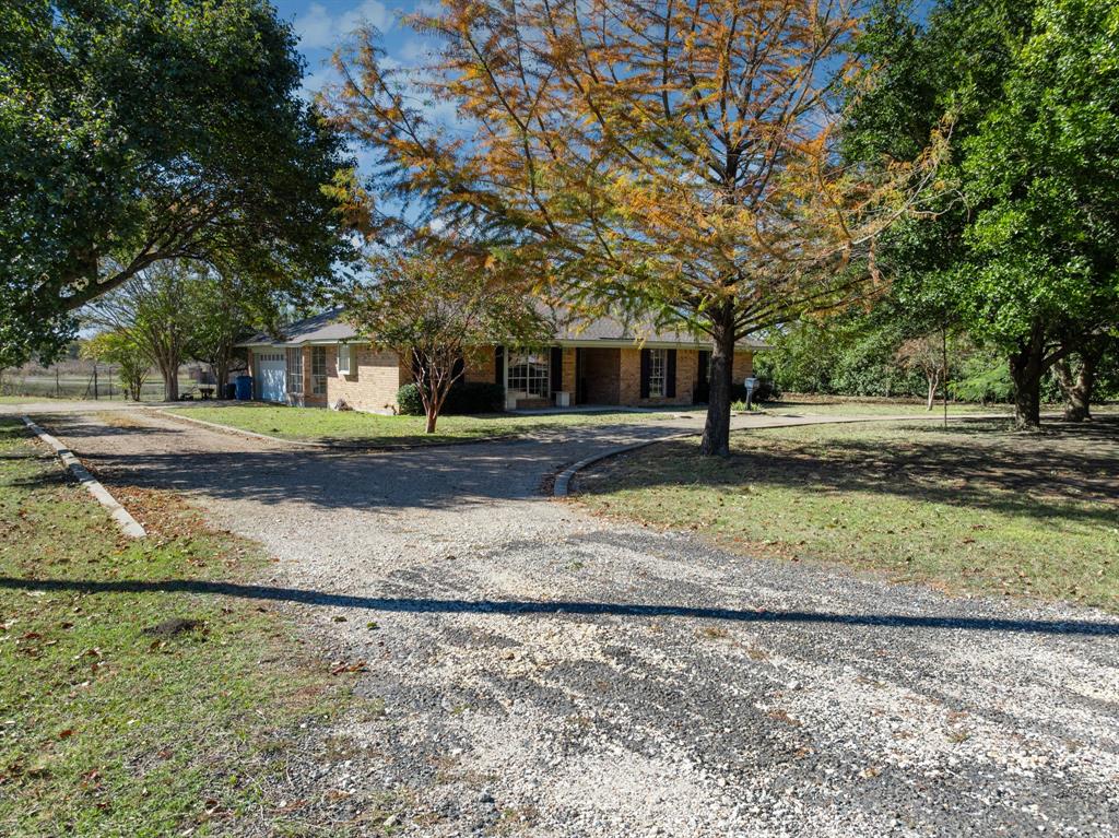 616 South Files Street Itasca, TX 76055 - Photo 33 of 37 a view of a large yard with large trees