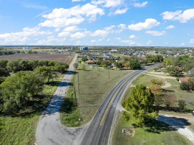 a view of a lake with a yard