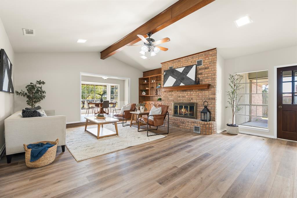 616 South Files Street Itasca, TX 76055 - Photo 8 of 37 a living room with furniture and a fireplace