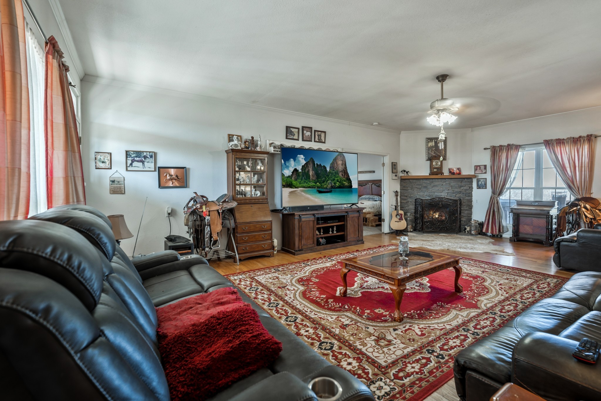 158 Big Springs Road Lawrenceburg, TN 38464 - Photo 26 of 54 a living room with furniture a fireplace and a flat screen tv