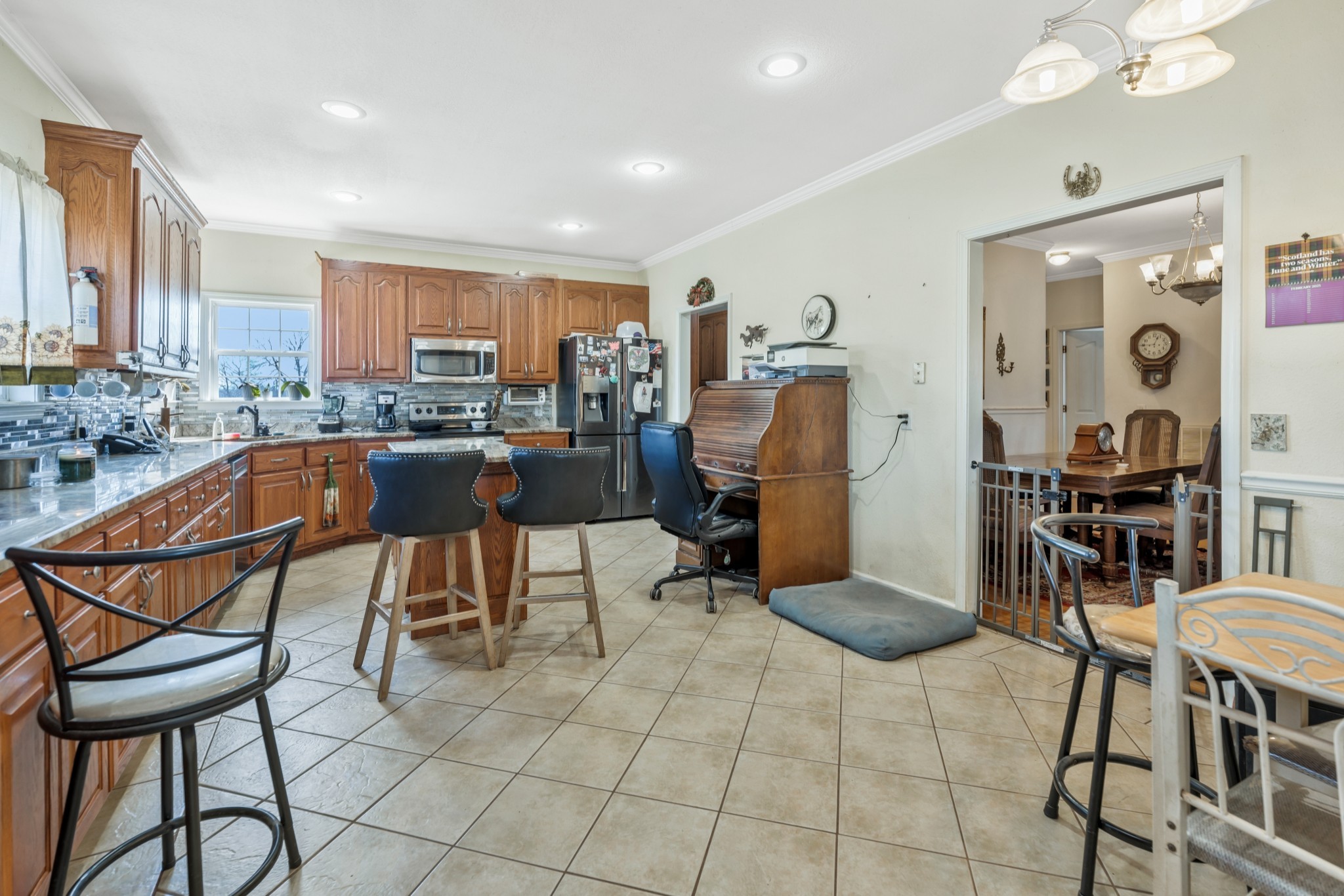 158 Big Springs Road Lawrenceburg, TN 38464 - Photo 28 of 54 a view of a dining room kitchen and a dining table chairs