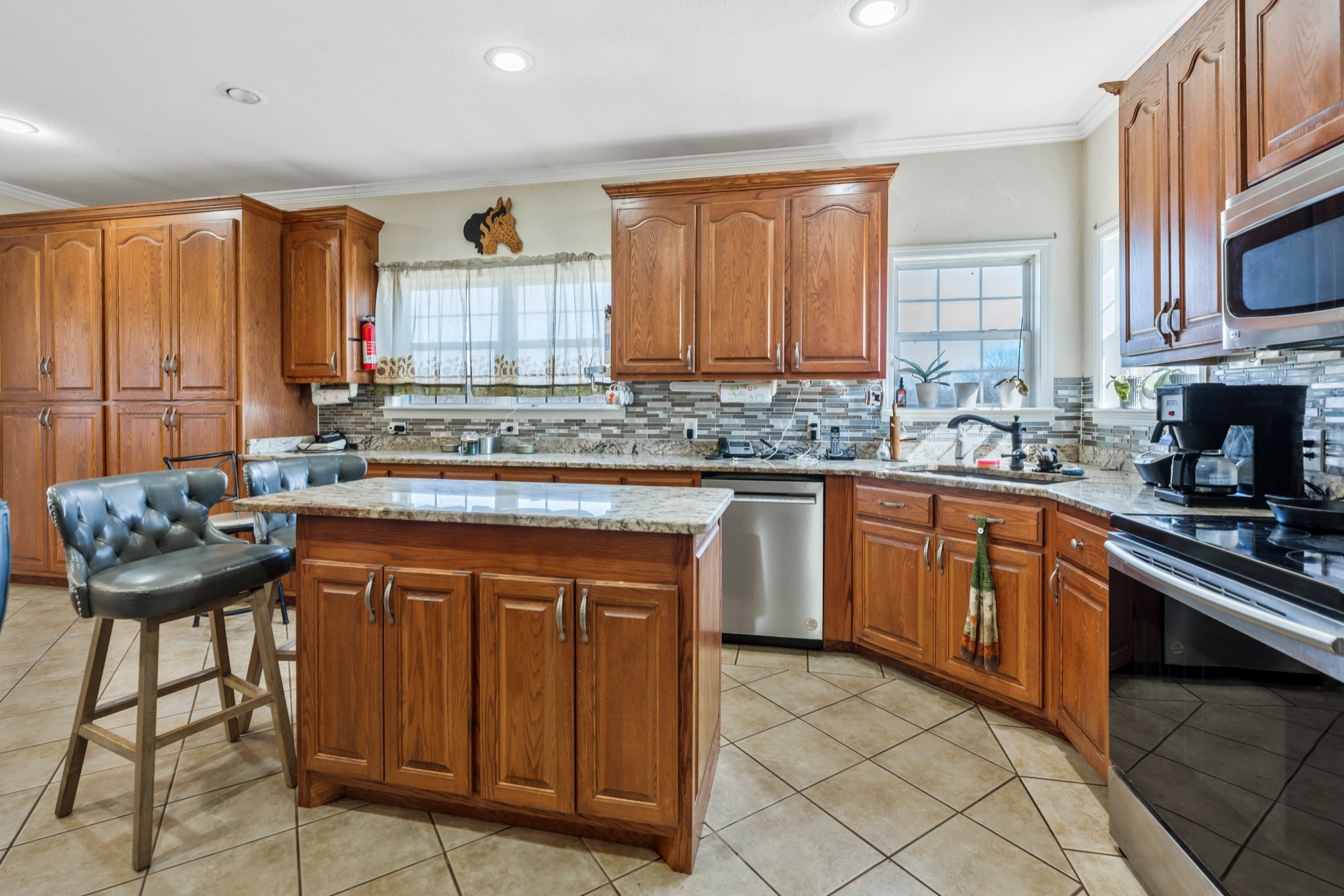 158 Big Springs Road Lawrenceburg, TN 38464 - Photo 29 of 54 a kitchen with stainless steel appliances a sink stove and cabinets