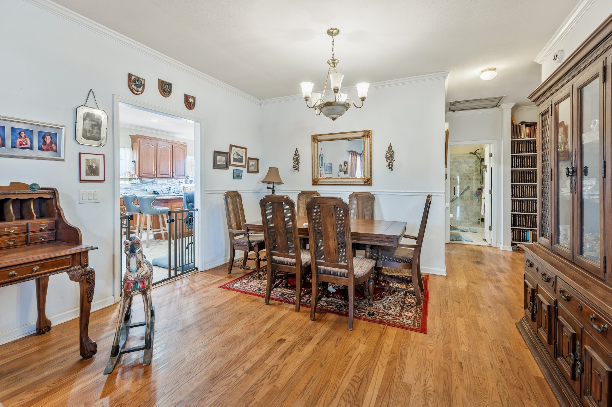 158 Big Springs Road Lawrenceburg, TN 38464 - Photo 33 of 54 a view of a dining room with furniture a chandelier and wooden floor