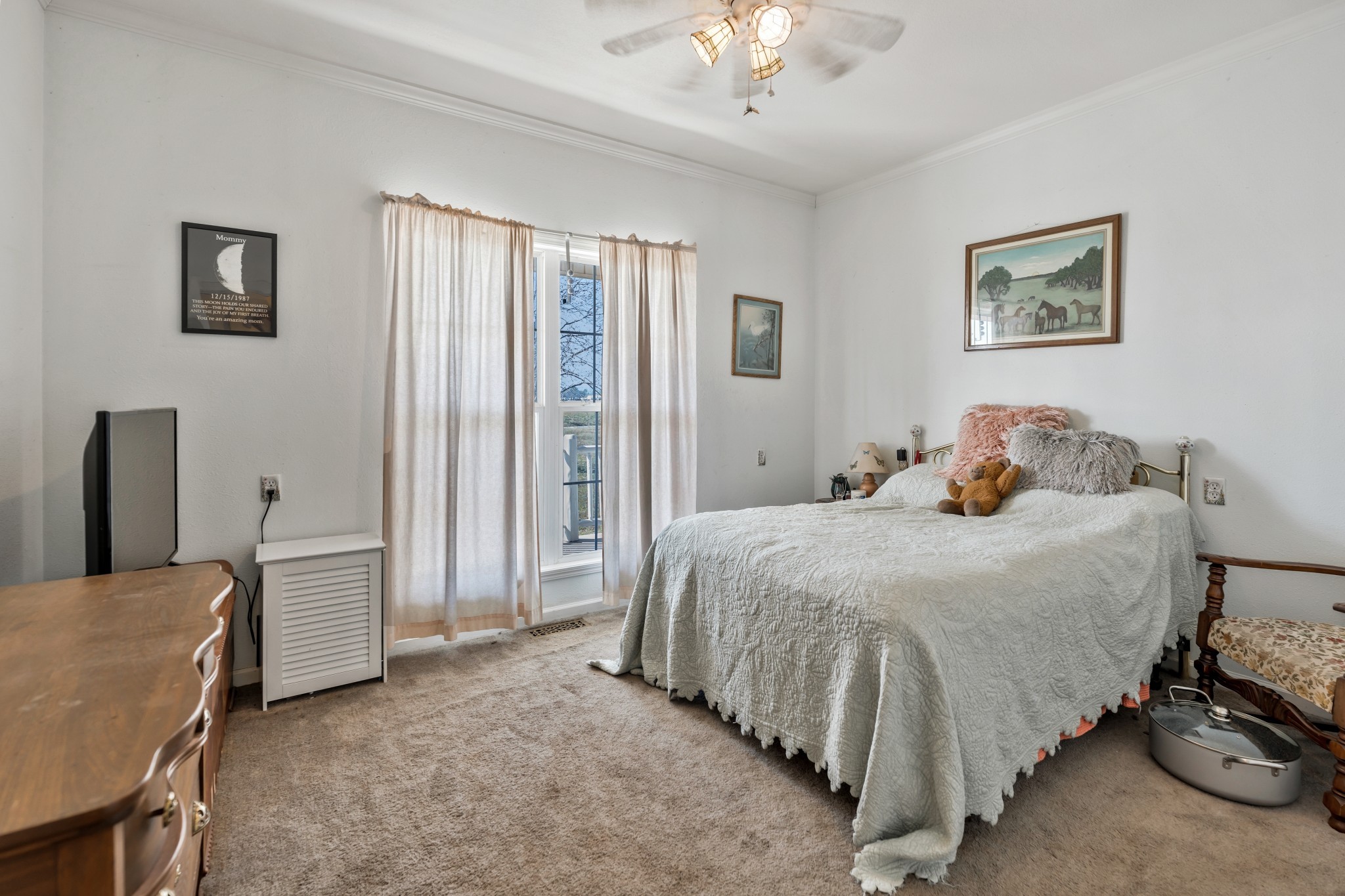 158 Big Springs Road Lawrenceburg, TN 38464 - Photo 41 of 54 a bedroom with a bed and a chandelier