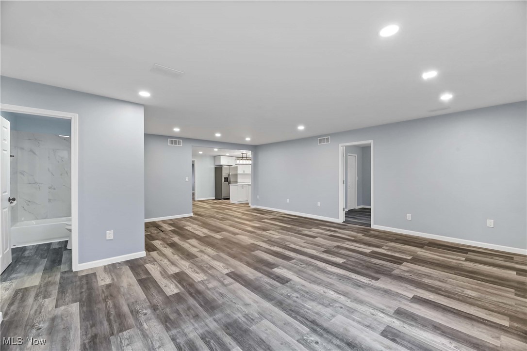 2022 Rohde Street Sandusky, OH 44870 - Photo 5 of 29 Unfurnished living and dining room featuring LVT flooring
