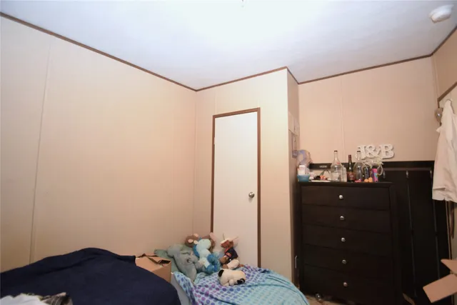 a bathroom with a sink mirror vanity and toilet