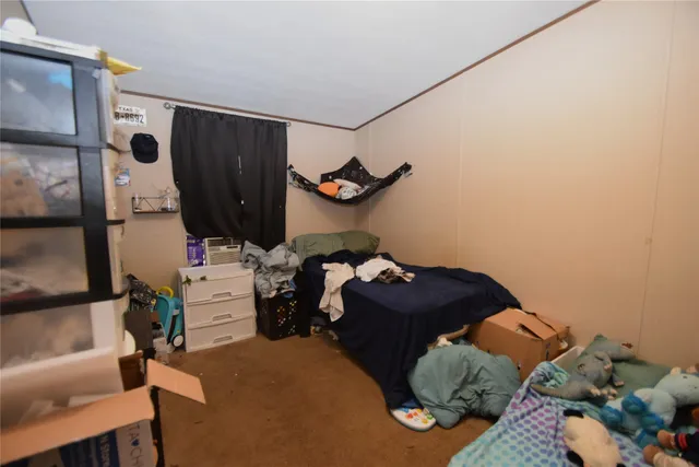a bathroom with a granite countertop sink and a toilet