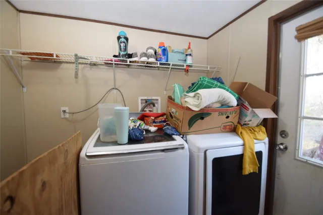 a bedroom with furniture and a chandelier