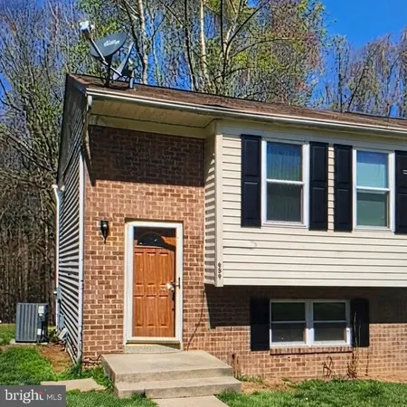 a front view of a house with garage
