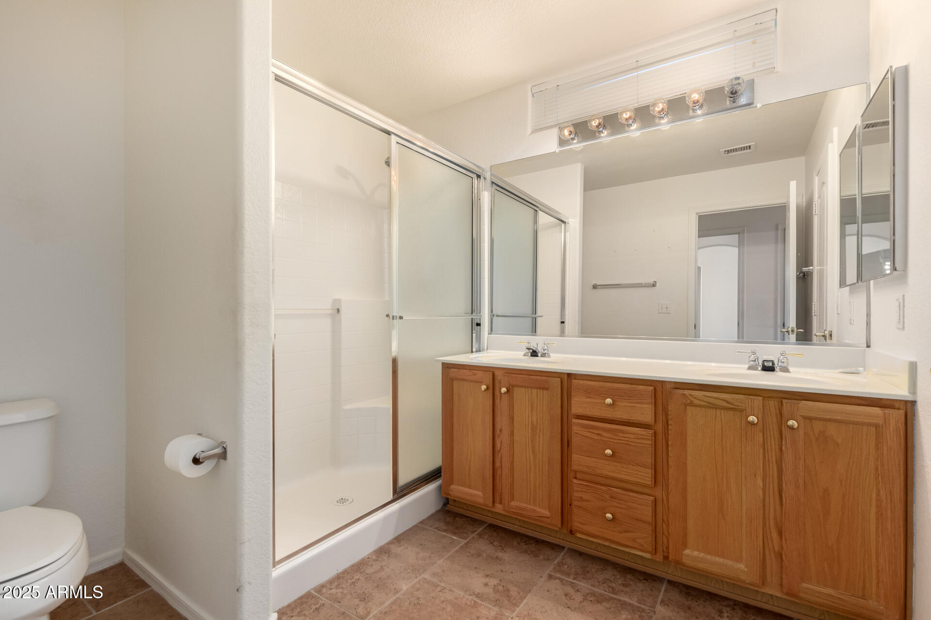 1475 East Riviera Drive Chandler, AZ 85249 - Photo 11 of 22 a spacious bathroom with a double vanity sink mirror and toilet