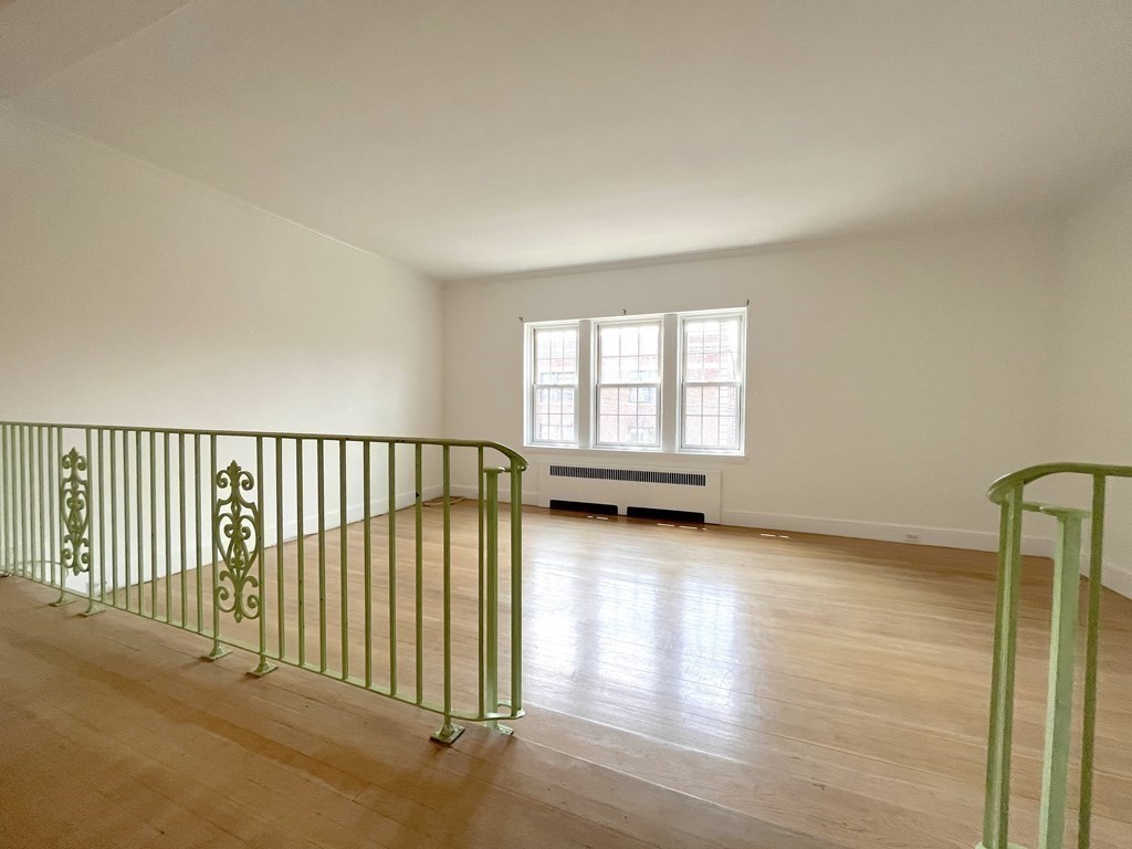 31 Park Street, Unit 6 Brookline, MA 02446 - Photo 5 of 13 a view of an empty room and window