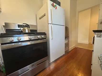 a kitchen with a stove and a refrigerator