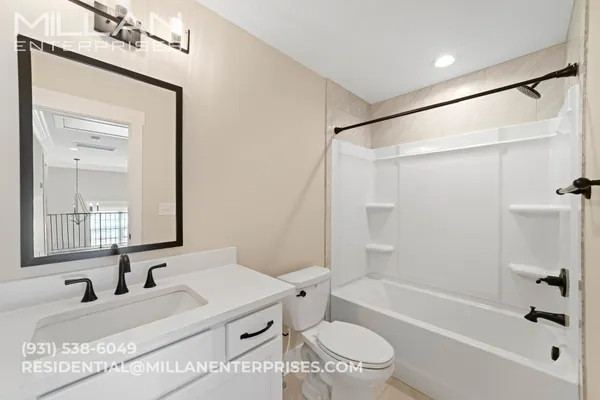 a bathroom with a sink a toilet and a bathtub